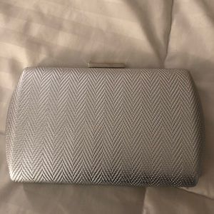 Sliver clutch or use with silver strap